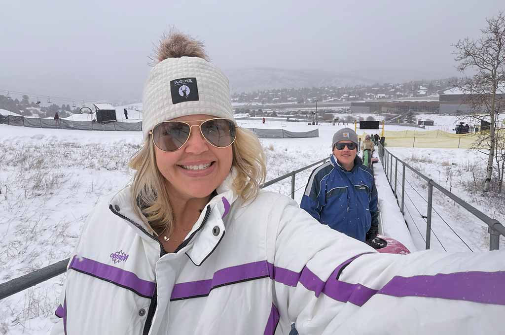 mother and son on tubing conveyor belt