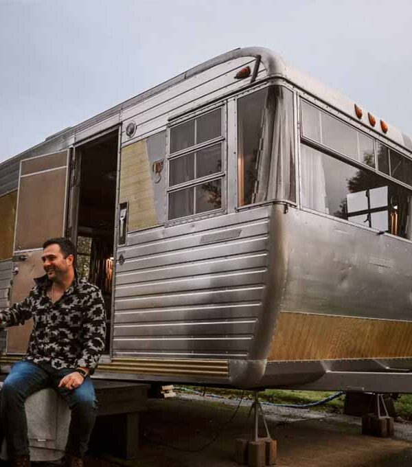 Man sitting in front of RV